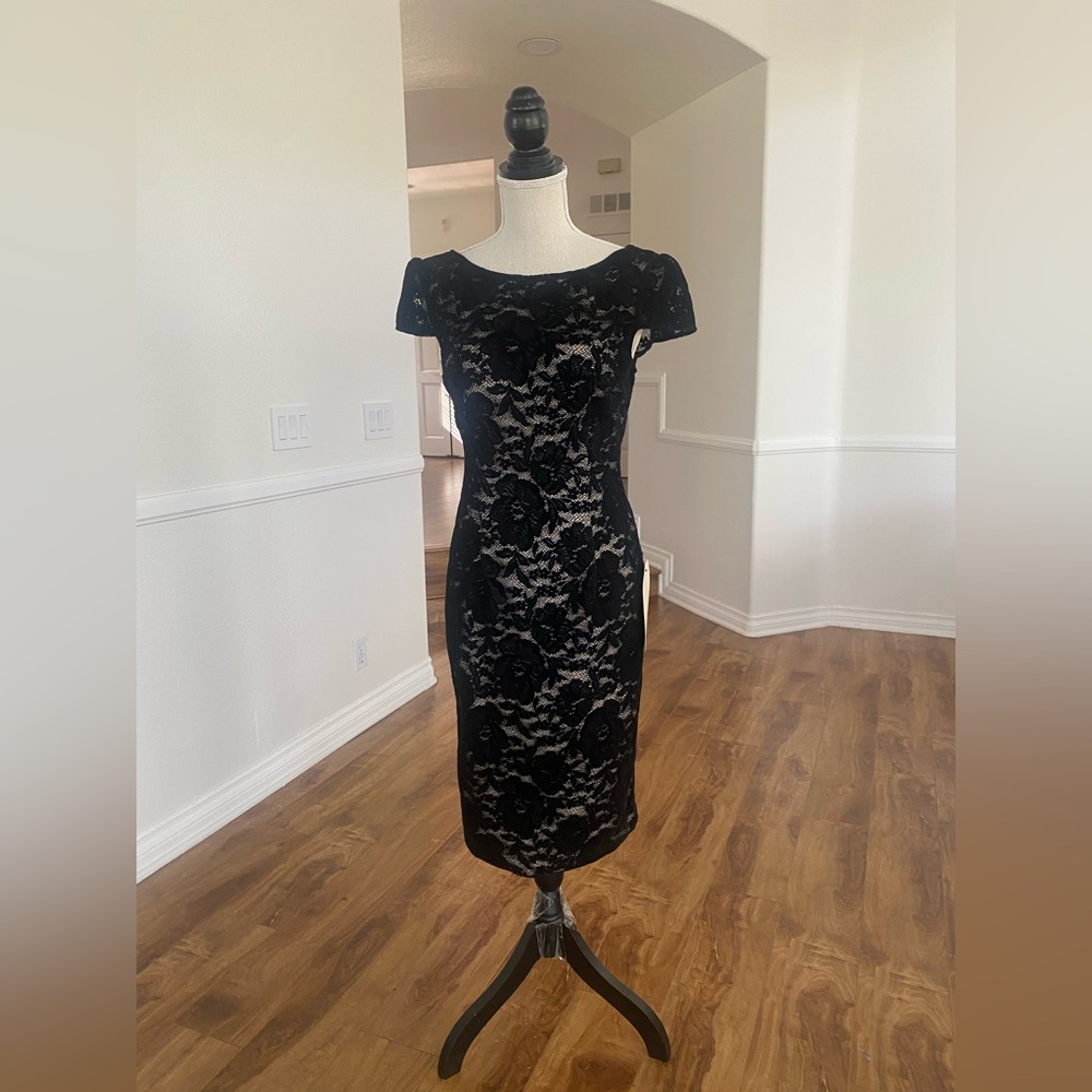 Black lace dress with cream lining.